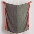 Detailed view of the dual-tone geometric pattern scarf with contrasting red border trim - 180x90cm / Green