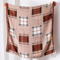 Detailed view of the earth-tone checkered cotton-linen scarf with fringed edges - Khaki