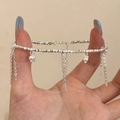 Dettaglio del bracciale argento con nappe, perle sfaccettate e ciondoli eleganti - Bracciale in Argento con Argento Frammentato