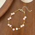 Detail of pink double-layer beaded bracelet with gold accents and adjustable lobster clasp - Pink Natural Stone Bracelet