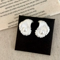 Elegant silver shell stud earrings with white pearl accents on minimalist black display card - Matte Silver Stud Earrings
