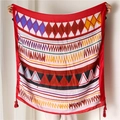 Detailed view of bohemian red beach shawl with vibrant geometric patterns and fringe tassels - Satin Cotton / Extended Specification / Multicolor Geometric Print