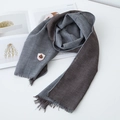Close-up of houndstooth cotton scarf with fringed edges and embroidered badge detail - 140x32cm / Grey Brown