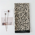 Detail shot of leopard print scarf featuring wide black hem and soft cotton-linen texture - C Style Rice Leopard