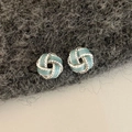 Detail of silver knot stud earrings with light blue enamel and twisted metal design - Blue