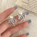 Detail of fan-shaped silver earrings with white pearl and micro-pave cubic zirconia accents - Silver Irregular Stud Earrings
