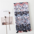 Floral patchwork scarf with blue tones and tassels displayed with a lifestyle aesthetic - Dark Blue Floral Patchwork