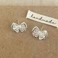 Elegant silver bow earrings with detailed filigree wings and sparkling zircon accents - Silver Butterfly Stud Earrings