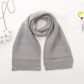 Close-up of light gray chunky knit baby scarf with soft wavy texture for winter - Light Gray
