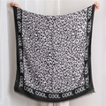 Macro view of leopard print shawl with fringe edges and COOL typography detail - 180*90CM / Grey Leopard Print (SL1910-030 Grey)