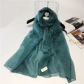 Detail of dark green silk wool scarf with pleated texture on camellia hanger - 190cm x 90cm / Turquoise Green
