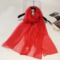 Detailed view of red semi-transparent silk wool scarf with a fine textured weave - 190cm x 90cm / China Red