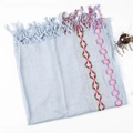 Close-up of light blue cotton linen scarf with colorful geometric embroidery and tassels - Light Blue Zircon
