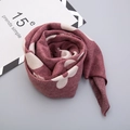 Detailed texture of soft dark red knit scarf featuring white floral print and folded rose shape - Wine Red (Large Flower Print)