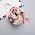 Close-up of soft pink and grey cashmere-like scarf with fringe edges and rose styling - Pink (Splicing Tassel Style)
