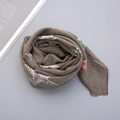 Close-up of thick knitted winter scarf with stars pattern and soft cashmere texture - 65*68cm / Dark Green