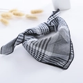 Detail of checkered cotton scarf with fine lockstitch edge and soft texture for kids - Small Checkerboard Black