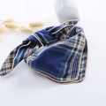 Close-up of navy and green plaid cotton linen scarf with elegant gold hem detail - Small Plaid Dark Blue
