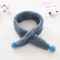 Soft blue plush crossover scarf for kids featuring fluffy pom-poms on clean white background - Cyan Blue