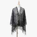 Close-up of black lace shawl featuring intricate floral hollow-out design and long fringes - 165x60cm / Black