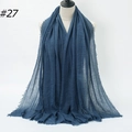 Navy blue crinkled cotton hijab scarf with fringed edges on a display mannequin, style #27 - Deep Blue Wrinkled Fringed Style (BS414-27#)