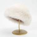 Close-up of white plush Mongolian style faux fur hat with thick warm texture on gold stand - 31*20 / 2# White