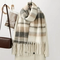 Detailed view of thick plaid scarf featuring soft cashmere-like texture and long tassels - Off-White