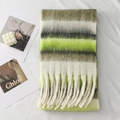 Detail of thick winter scarf with green and grey stripes and long fringe tassels - Gray Green