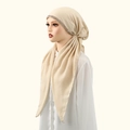 Close-up of sparkling rhinestone trim on elegant beige cotton hijab headscarf - Beige