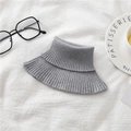 Detailed close-up of a grey ribbed knit neck warmer on a cozy white fabric background - Light Gray