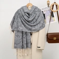 Detail view of gray paisley cashmere-feel scarf with tassels on beige wool coat - YR352-05# Grey