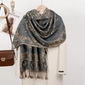 Elegant paisley jacquard shawl with tassels over a beige coat for a stylish winter look - Gray
