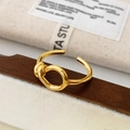 Minimalist gold knot open ring displayed on a wooden stand with elegant packaging - Knot Opening Ring / Gold