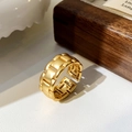Detail of a matte gold open ring with a geometric tank chain structure on a jewelry box - Chain Ring / Gold