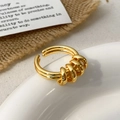 Detailed view of adjustable gold open ring with four decorative moving rings on white porcelain - Four-Ring Decorative Open Style / Gold