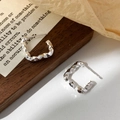 Minimalist irregular crumpled U-shaped silver earrings with textured metallic finish - Silver