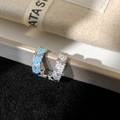Detail of silver C-shape ear cuffs with micro-set white zircon and sky blue accents - Silver Blue Zirconia Ear Cuff