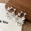 Minimalist silver beads and clear glass drop earrings shown on a rustic wooden stand - Silver Glass Beaded Earrings