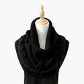Detail of black cable-knit infinity scarf with thick texture and ribbed edges on a mannequin - Cable Knit Snood / Black