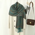 Blue-green paisley jacquard shawl with long tassels styled over a white autumn coat - Blue Green Retro (VS929)
