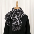Detail of gray leopard print winter scarf with tassels and soft cashmere-like texture - Black Gray