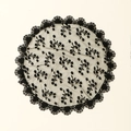 Elegant black circular lace veil with floral embroidery on a minimalist white background - Black