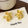 Macro shot of gold iris flower earrings with metallic texture on a Thank You display card - Gold Flower Stud Earrings (A-1825)