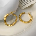 Close-up of golden irregular textured hoop earrings inside a white ceramic bowl - Gold-2.5cm