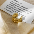 Close-up of a triple-layered gold ear cuff with chain links and bead details - Gold