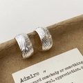 Chic silver C-shaped stud earrings with herringbone texture on a neutral brown backdrop - Herringbone Textured C-Shaped Style (A-1810)