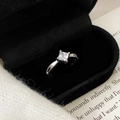 Macro detail of silver ring with square-cut zircon and vintage milgrain edge decoration - Silver Ring