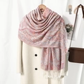 Bohemian paisley jacquard scarf with tassels displayed on a beige coat for winter style - White Pink