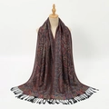 Close-up of paisley jacquard pattern and black tassel fringe on soft polyester shawl - Black Red