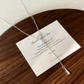 Elegant Y-shaped necklace with teardrop zircon and pearl on a dark wooden background - Bright Luster Pearl Tassel Necklace